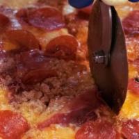 Italian Meat Pizza · Sausage, prosciutto, salami, pancetta, pepperoni, red sauce.