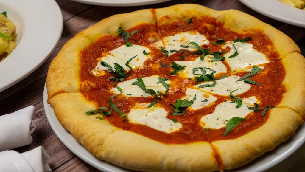 Fresh Mozzarella Pizza · Red sauce, basil, olio verde.