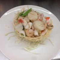 Birds Nest Delicacies 鸟巢 · Shrimp, scallop and crab meat sauteed in special white sauce with assorted vegetables contai...