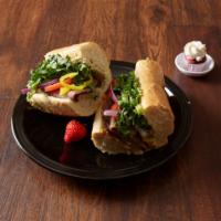 Spicy Beef Sandwich · Thin sliced roasted beef, pepper jack cheese, romaine lettuce, red onion, tomato and jalapen...