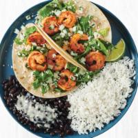 Chipotle Garlic Shrimp Two Taco Plate · Sustainably sourced grilled shrimp served on a warm flour tortilla with crisp romaine lettuc...