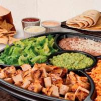 Family Taco Kit · Choice of all-natural grilled chicken, USDA Choice Steak or grilled shrimp, choice of pinto ...