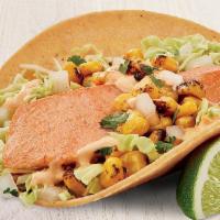Atlantic Salmon Two Taco Plate · Two tacos made with fire-roasted corn, creamy chipotle sauce, cilantro, onion and cabbage.  ...