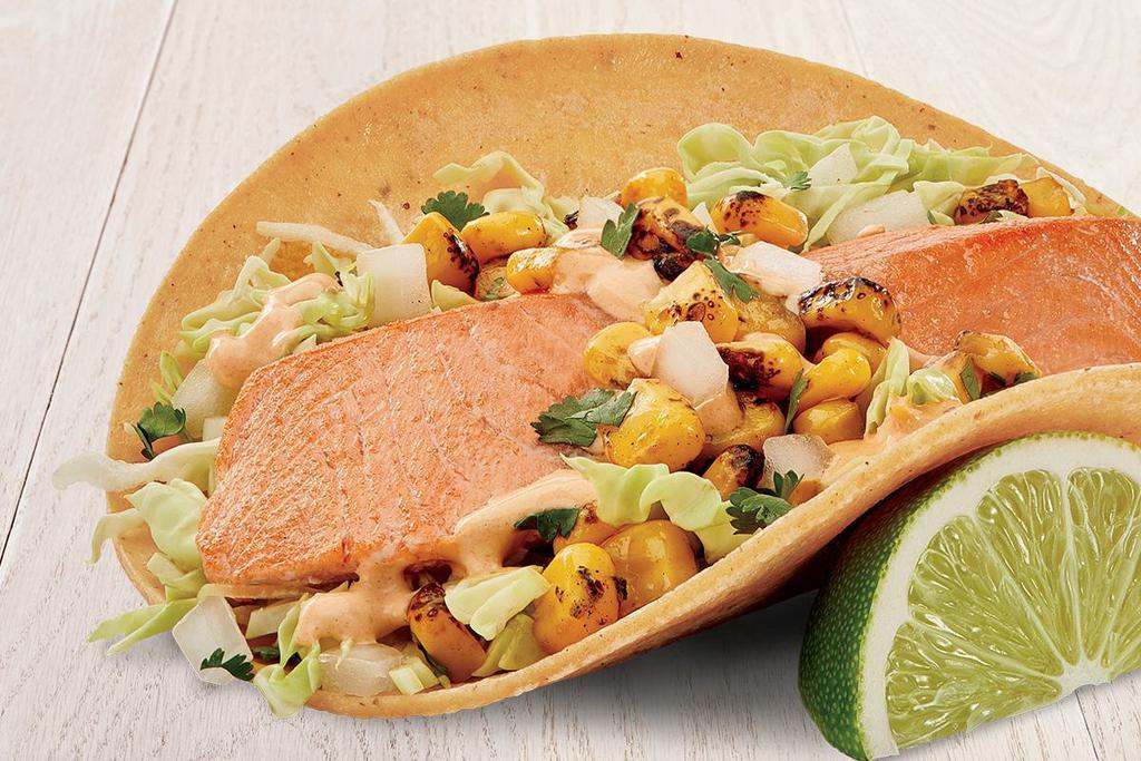 Atlantic Salmon Two Taco Plate · Two tacos made with fire-roasted corn, creamy chipotle sauce, cilantro, onion and cabbage.  Served on stone-ground stone tortillas. Served on stone-ground stone tortillas with 