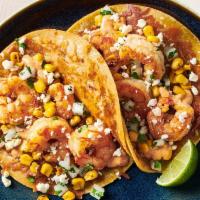 Mexican Street Corn Shrimp Two Taco Plate · Two Tacos with grilled shrimp and Mexican street corn topped with cotija cheese, chipotle sa...