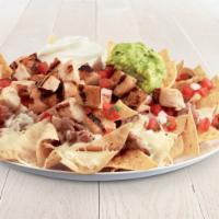 Loaded Nachos · Cheese, fresh guacamole, pinto beans, sour cream and salsa fresca. Also available with all n...