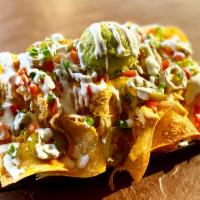 Nachos · Choice of protein. Add sides of toppings for an additional charge. 