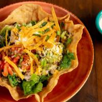 Taco Salad · Your choice of chicken, beef, or beans, served with guacamole, sour cream, pico de gallo, an...
