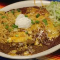 Two Meat Enchilada Dinner · Two enchiladas served with Spanish rice and refried beans, with you choice of chicken or bee...