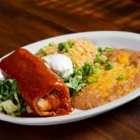 Chimichanga Dinner · Crispy chimi with your choice of chicken or beef served with rice and beans. 