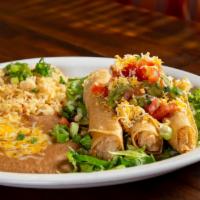 Flautas Dinner · Three flautas with guac, cheese, and lettuce on top. Served with Spanish rice and beans. 