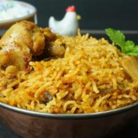 Chicken Biryani · Served with basmati rice flavored with cloves, cinnamon, cardamom, bay leaf, coriander, mint...
