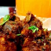 Chicken Sukka Varuval · Boneless chicken in Chettinad style - dry. With white rice. Spicy.