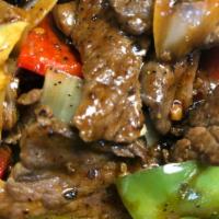 B5. Pepper Steak · Beef, onions, red and green peppers, black pepper, Chinese black beans brown sauce.