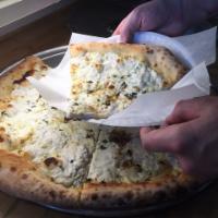 Bianco Pizza · Herb ricotta, goat cheese, feta, fresh mozzarella and garlic olive oil.
