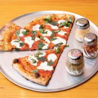Margherita Pizza · Fresh mozzarella, fresh tomato sauce and basil.