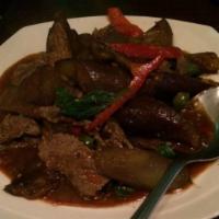 44. Spicy Eggplant · Meat stir - fried with Chinese eggplant, sweet basil, and bell pepper in red curry sauce.