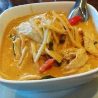 48. Red Curry · Red curry and coconut milk, with bamboo -shoots, bell pepper and sweet basil. Medium spicy.