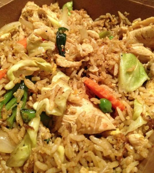 62. Yellow Curry Fried Rice · Stir-fried rice plus egg, yellow curry powder, green peas, onion, carrots, and cabbage.