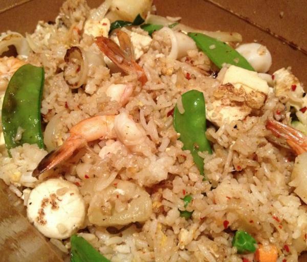 63. Classic Thai Fried Rice · Stir-fried jasmine rice with scallops, prawns, calamari, pineapple, egg, and diced fresh vegetables.