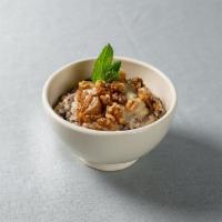 Multigrain Porridge with Banana Jam · Blend of millet, buckwheat, steel-cut oats and red quinoa, almond milk, topped with banana j...