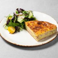 Quiche Lorraine · Buttery crust filled with savory custard, ham, Gruyere, and leeks