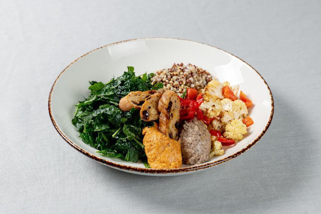 Ancient Grain Bowl · Red quinoa, millet, buckwheat, massaged kale, roasted red pepper and cauliflower, pickled fresno, muhammara, black lentil pate, hazelnut crisps, harissa-tahini dressing
