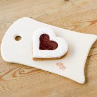 Heart Linzer · Heart shaped butter cookies with a scrumptious layer of berry jam and dusted with powered su...