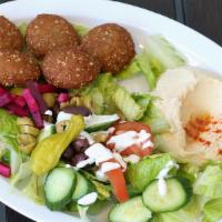 11. Falafel Platter · Falafel patties served with tahini sauce, homemade hummus house salad and pickled turnips. 