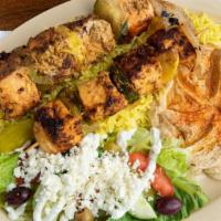 Salmon Kabob · 2 skewers of marinated salmon with veggie and onions. Served with homemade hummus, rice, hou...
