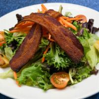 The Grille Salad · Cherry tomatoes, carrot, butcher-cut bacon, garlic croutons, vinaigrette.