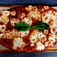 Margherita · House-made mozzarella, tomato sauce, fresh basil