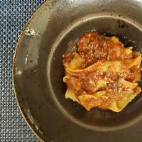 Pappardelle al ragu di agnello   · House-made ribbon pasta, tomato braised lamb shank, pecorino Romano