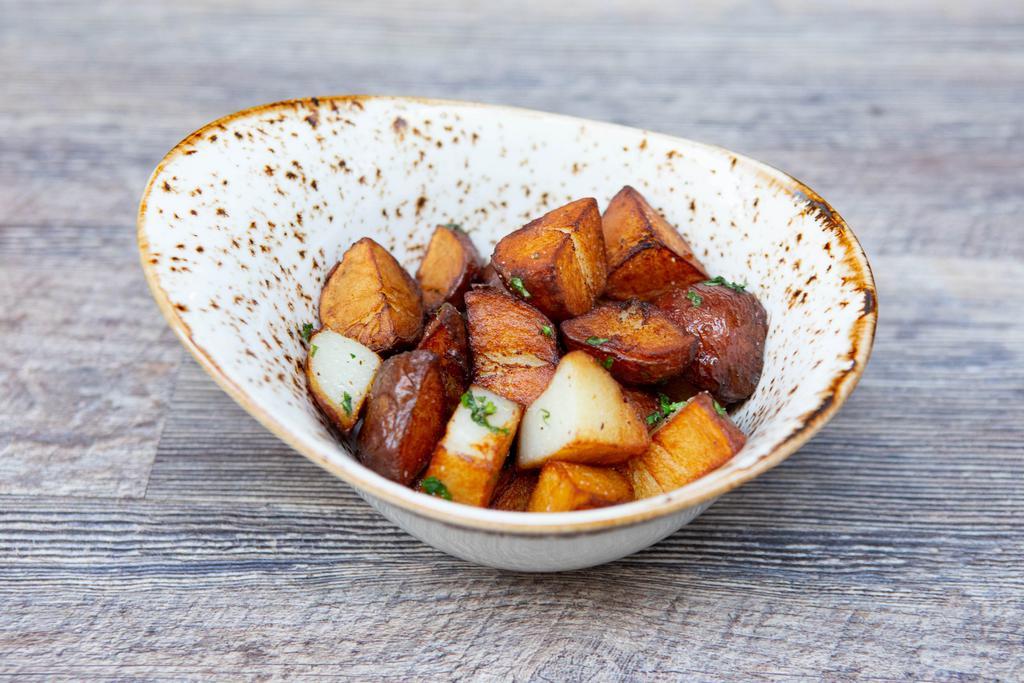 Roasted Potatoes · Roasted red bliss potatoes, garlic and rosemary.