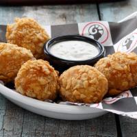 Armadillo Eggs · Chicken, diced jalapenos, pepper Jack, cream cheese, secret sauce and seasonings. Rolled in ...