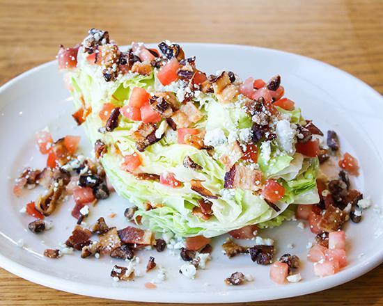 The Wedge Salad · Grilled or Blackened Chicken, iceberg, blue cheese dressing, tomato, bacon, crumbled blue cheese