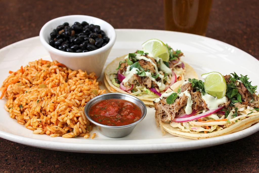 Ram Tacos · Pickled red onion, cilantro crema, chipotle-tarragon slaw with red rice, black beans, salsa, choice of corn or flour tortilla. With your choice of protein