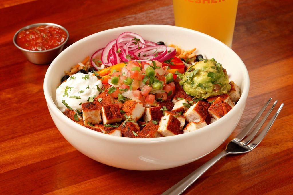 Blackened Chicken Bowl · Spanish rice, cabbage, black beans, smoked Anaheim peppers, shredded pepper jack, pico de gallo, guacamole, pickled red onions, sour cream, red bell peppers, finished with chopped cilantro.