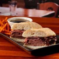 French Dip Sandwich · Roast beef, au jus, grilled hearth-baked French roll. Add cheese, mushrooms or caramelized o...