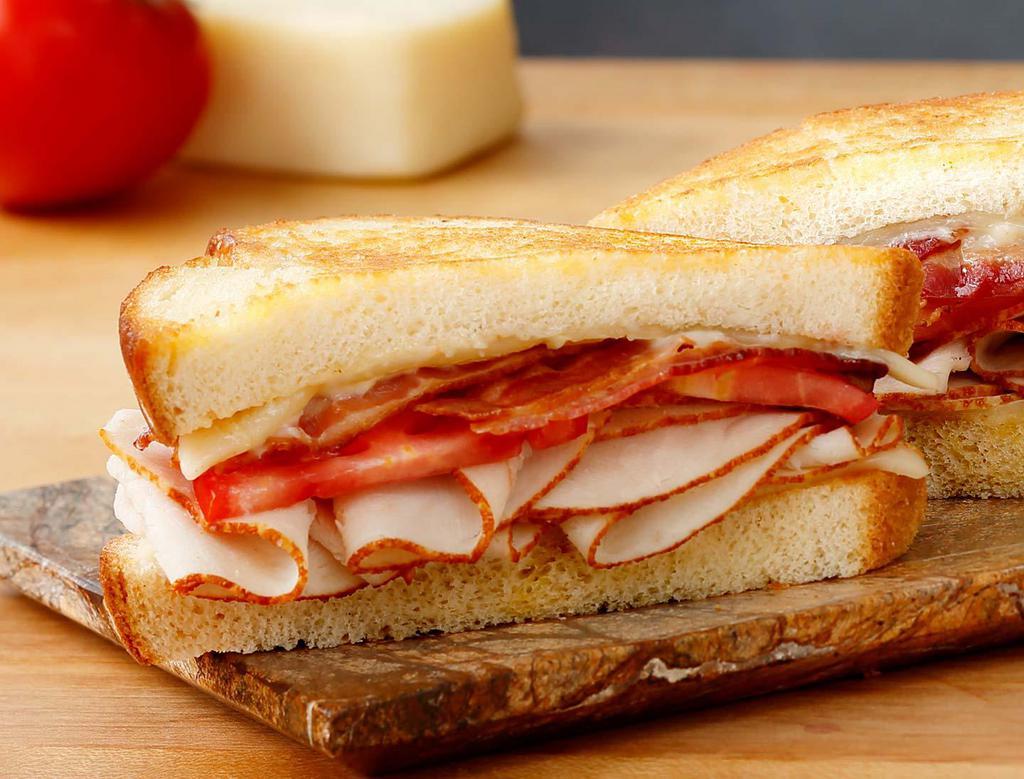 Turkey Havarti Melt · Sliced turkey, Wisconsin Havarti, garlic mayo, tomato, applewood-smoked bacon and grilled old-fashioned white bread. Add sliced avocado for an additional charge.
