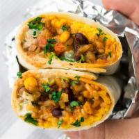 The Southwest Veggie Burrito · Double rice and black beans, lettuce, tomatoes, onions, salsa verde, guac, baja sauce, shred...