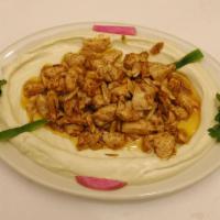 Hommous with Chicken · Gluten free. A bed of smooth hommous filled with chicken and almonds with choice of 2 sides.