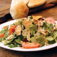 Fattoush Salad · A La Marsa Specialty. Our garden salad enhanced with toasted pita chips and special seasonin...