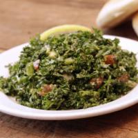 Tabbouli Salad · A chopped parsley salad with tomatoes, scallions, cracked wheat, lemon juice and herbs. Vegan.