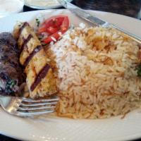 Shish Kafta · Quality ground meat or chicken mixed with parsley, onions and seasonings, char-broiled. Serv...