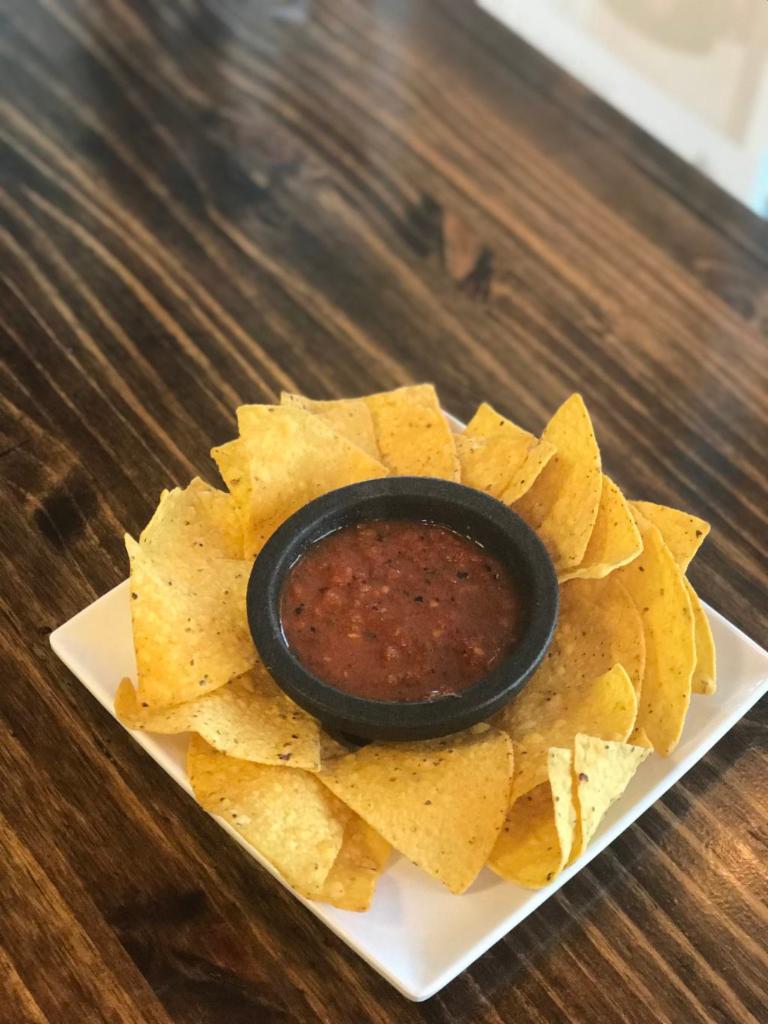 chips + salsa · Freshly made corn tortilla chips served with homemade warm salsa.