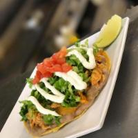 tostada · choice of meat with refried beans / Romaine / pico / cheese + crema