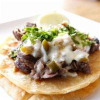 chilango taco *no substitutions* · grilled steak + chorizo w/jalapeño-caramelized onion + melted cheese