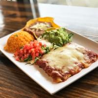 steak enchiladas · three enchiladas topped with mole poblano