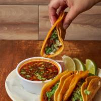 Special 3 Birria Tacos and Consome ·  Shedded beef stew simmered in a sauce of blended chile peppers on side broth Birria.
